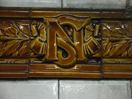 light brown North-South logo