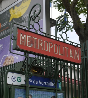 rectangular red sign in a green metal frame