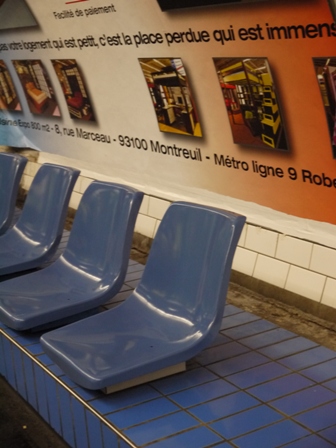 blue plastic seat on platform of line 7