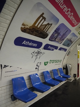 blue plastic seats in front of advertising